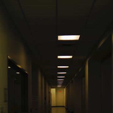 a long hallway with light on the ceiling