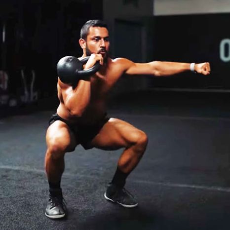 man exercising with kettlebell