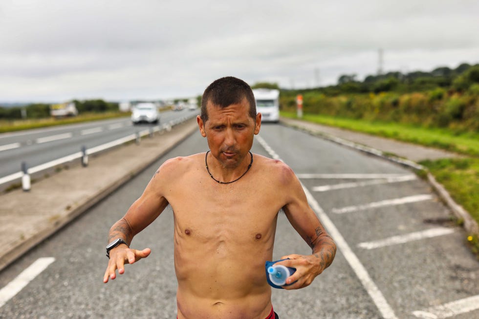 Road, Finger, Human body, Infrastructure, Road surface, Hand, Asphalt, Chest, Barechested, Abdomen, 