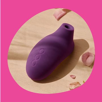 two modern personal massagers on colored backgrounds two modern personal massagers on colored backgrounds