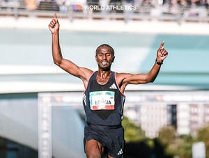 a person running with the arms raised