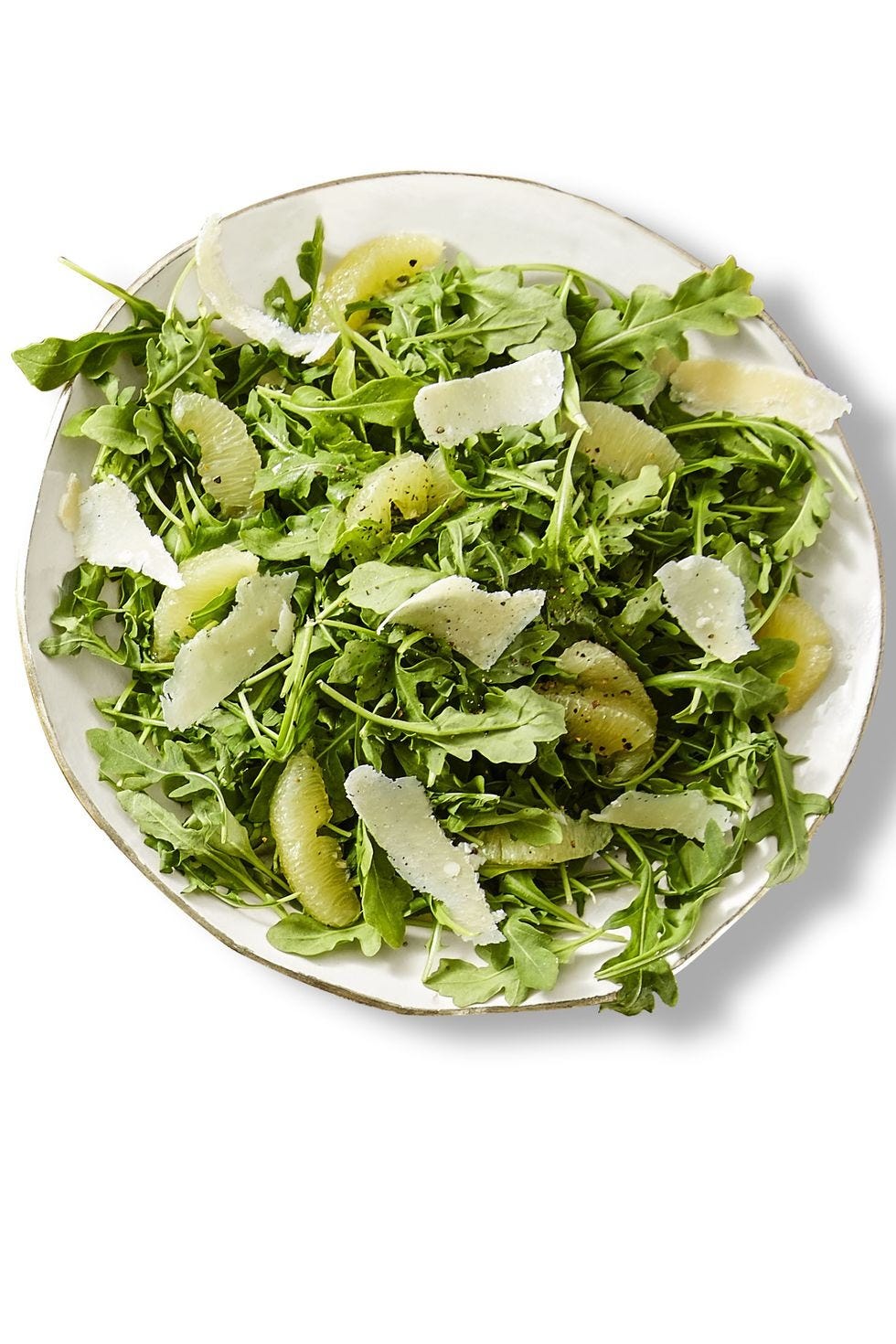 lemon arugula thanksgiving salad on a white plate