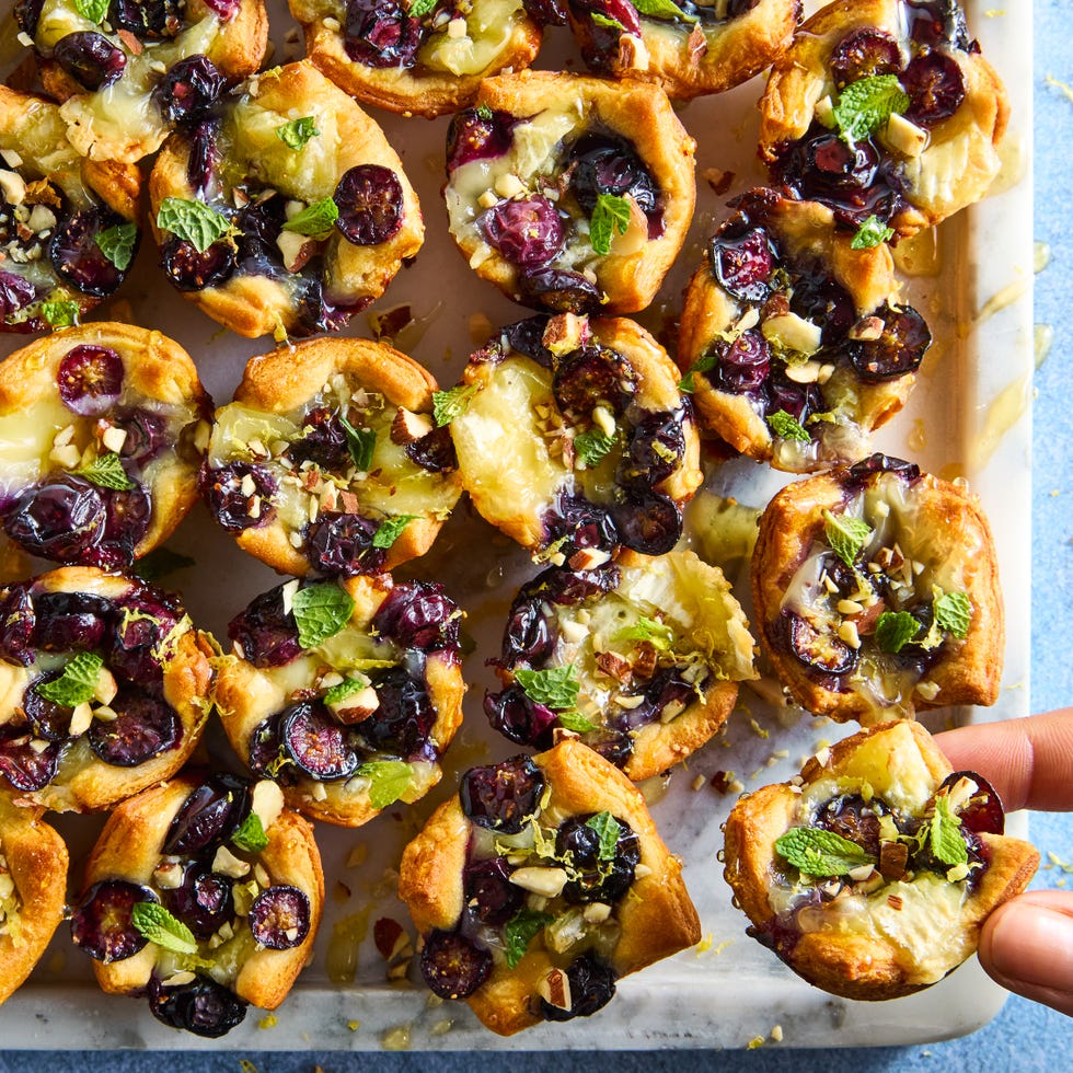 crescent dough baked and filled with brie, sliced blueberries, almonds, and honey