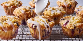 lemon blueberry muffins topped with a crumble topping and glaze
