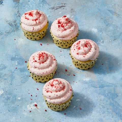 lemon cupcakes with strawberry frosting and crushed freeze dried strawberries on top