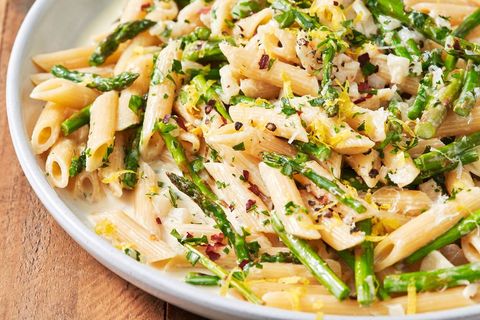 lemon asparagus penne pasta topped with parmesan and red pepper flakes