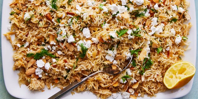 lemon herb rice pilaf topped with almonds, feta, and parsley
