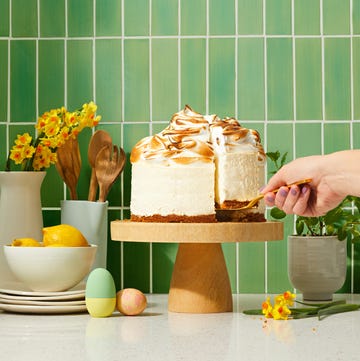 Lemon Meringue Cheesecake lemon meringue cheesecake on a wooden cake stand
