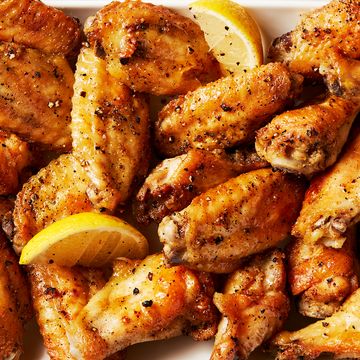 baked chicken wings tossed in a lemon pepper sauce served with lemon wedges