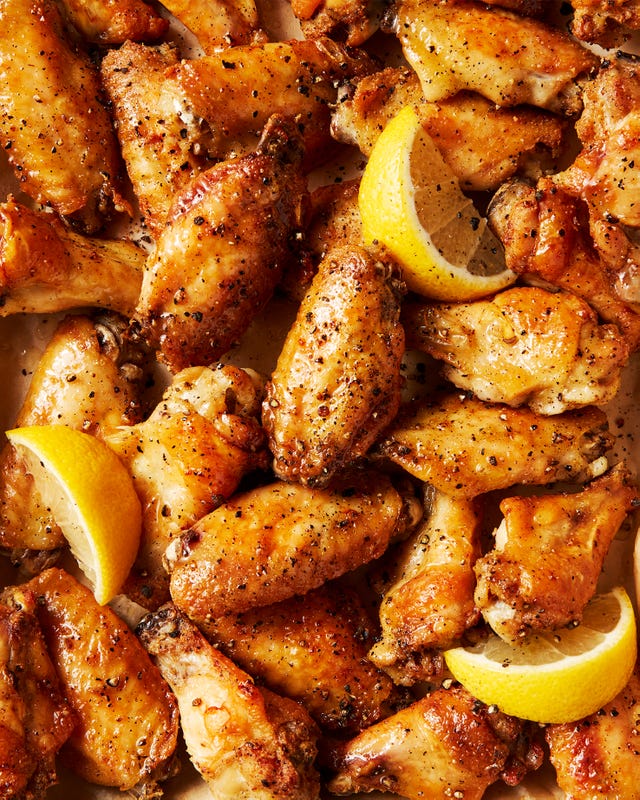 baked chicken wings tossed in a lemon pepper sauce served with lemon wedges