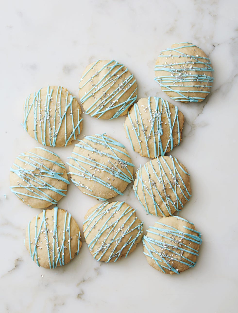 lemony ricotta pillows with blue icing drizzled on top