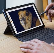 man drawing with pen on lenovo chromebook duet