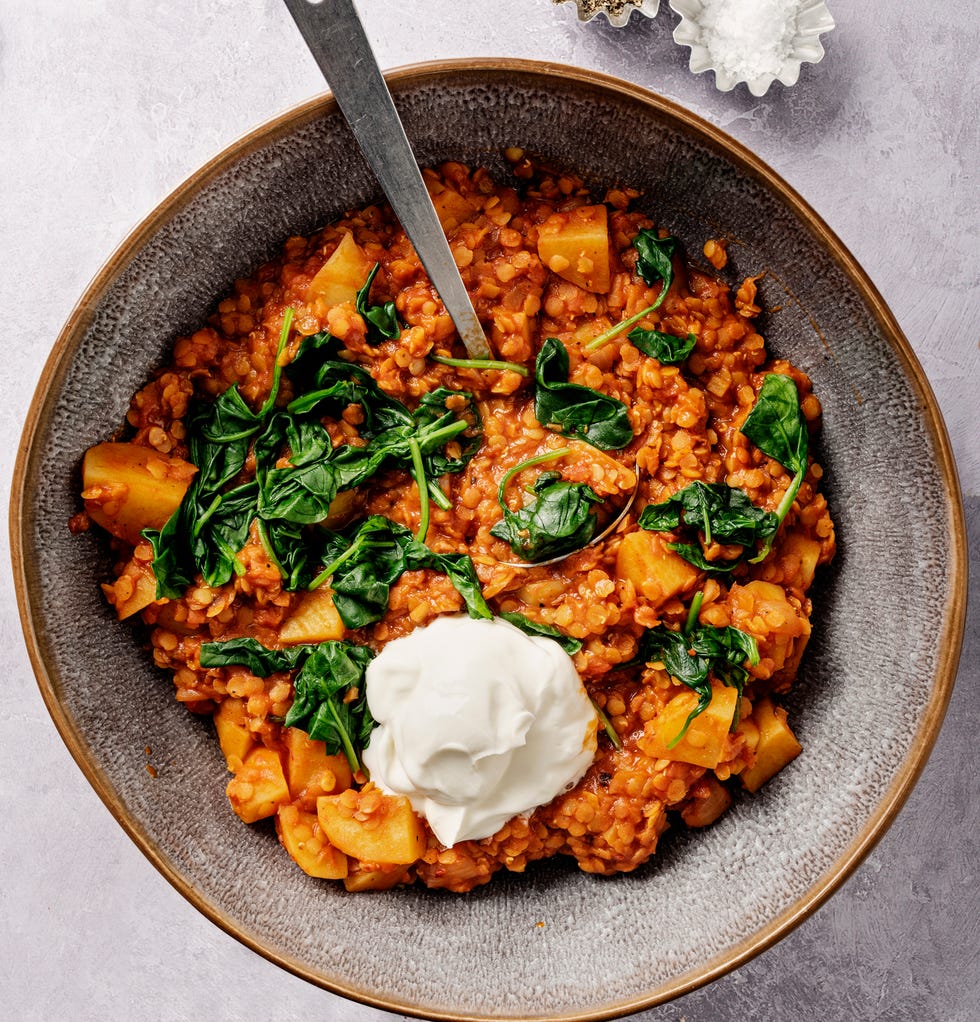 lentil and potato stew with wilted spinach and greek yoghurt