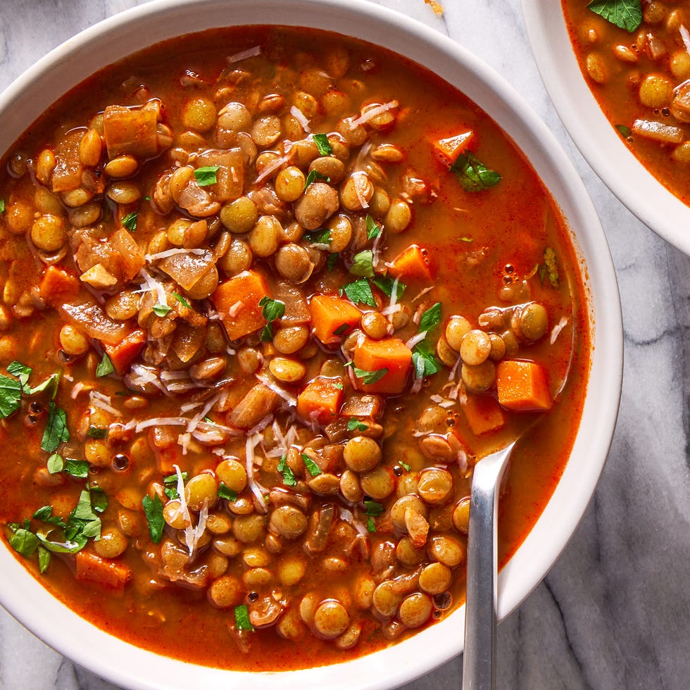 lentil soup garnished with parmesan and parsley