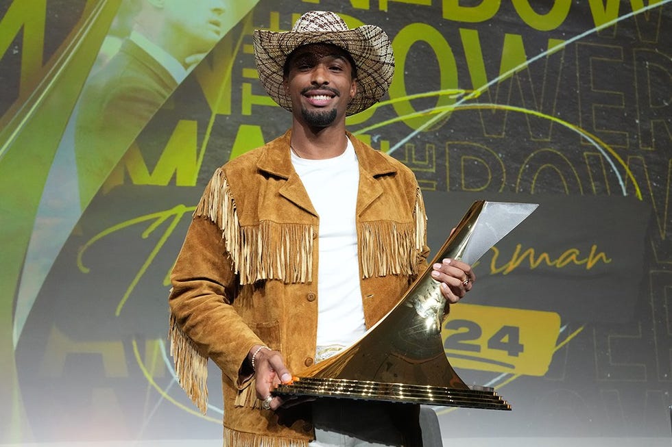 award ceremony with a figure holding a trophy