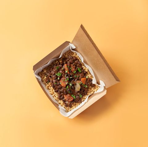 leon brazillian black bean box with carrots and onion, spiced with smoked paprika, oregano, mint and parsley