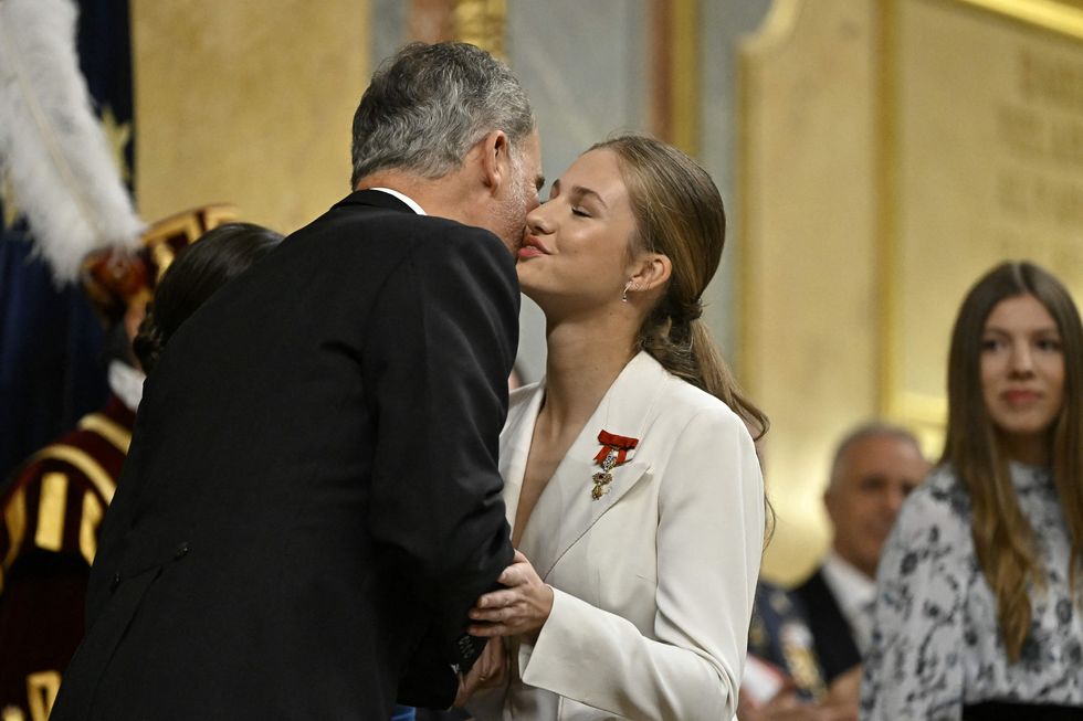 spains king felipe vi l congratulates spanish crown princess of asturias leonor during a ceremony to swear loyalty to the constitution, on her 18th birthday, at the congress of deputies in madrid on october 31, 2023 princess leonor, heir to the spanish crown, will swear loyalty to the constitution on her 18th birthday, a milestone that will help turn the page on the scandal tainted reign of her grandfather, juan carlos after taking the oath, princess leonor can legally succeed her father, king felipe vi, and automatically becomes head of state in the event of the monarchs absence photo by javier soriano afp photo by javier sorianoafp via getty images