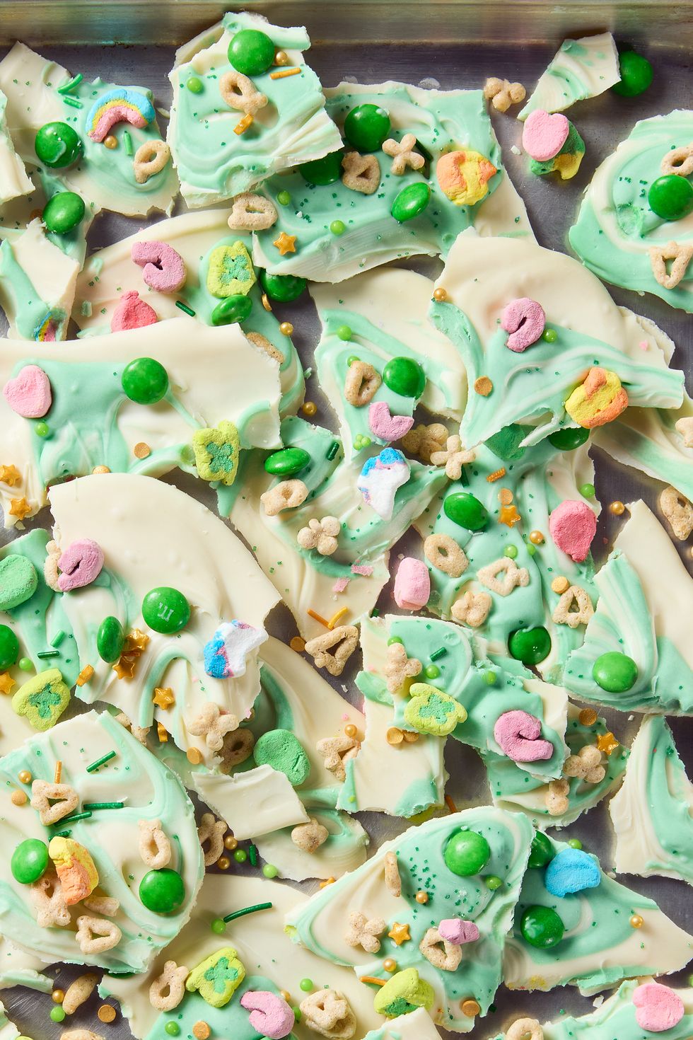 white chocolate candy bark with lucky charms and green candy