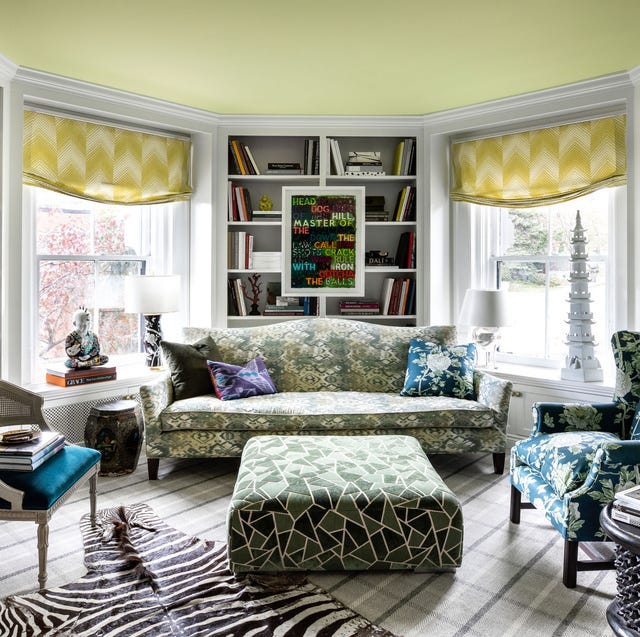 sitting room with green floral furniture and accents