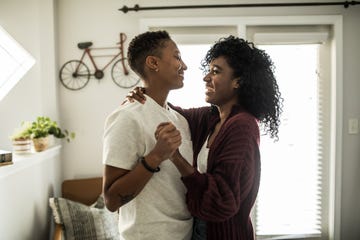 a couple dancing in living room