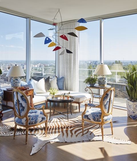 the penthouses scenic second floor serves as a relaxed lounge for the family and has a couch and chairs and an alexander calder mobile