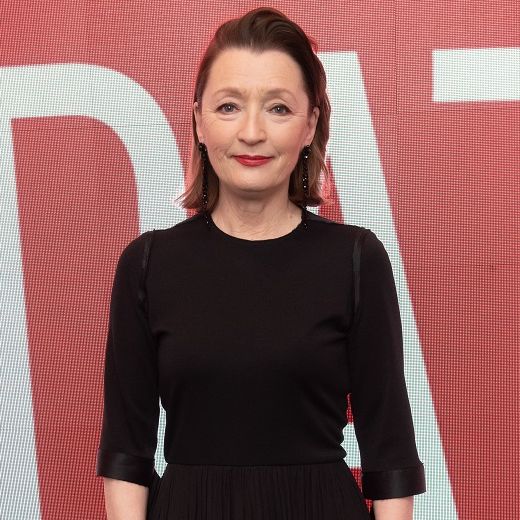 lesley manville poses at an event in february 2020