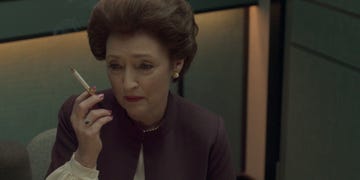a person holding a cigarette in a professional setting