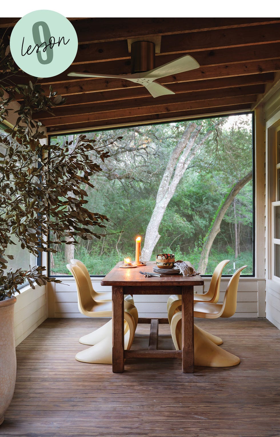 dining area with table chairs and view of nature