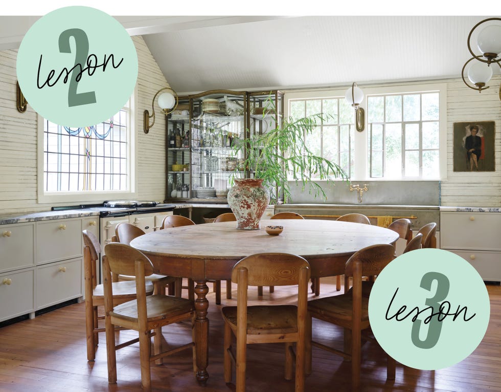 dining area featuring a round wooden table surrounded by chairs potted plant and a display cabinet