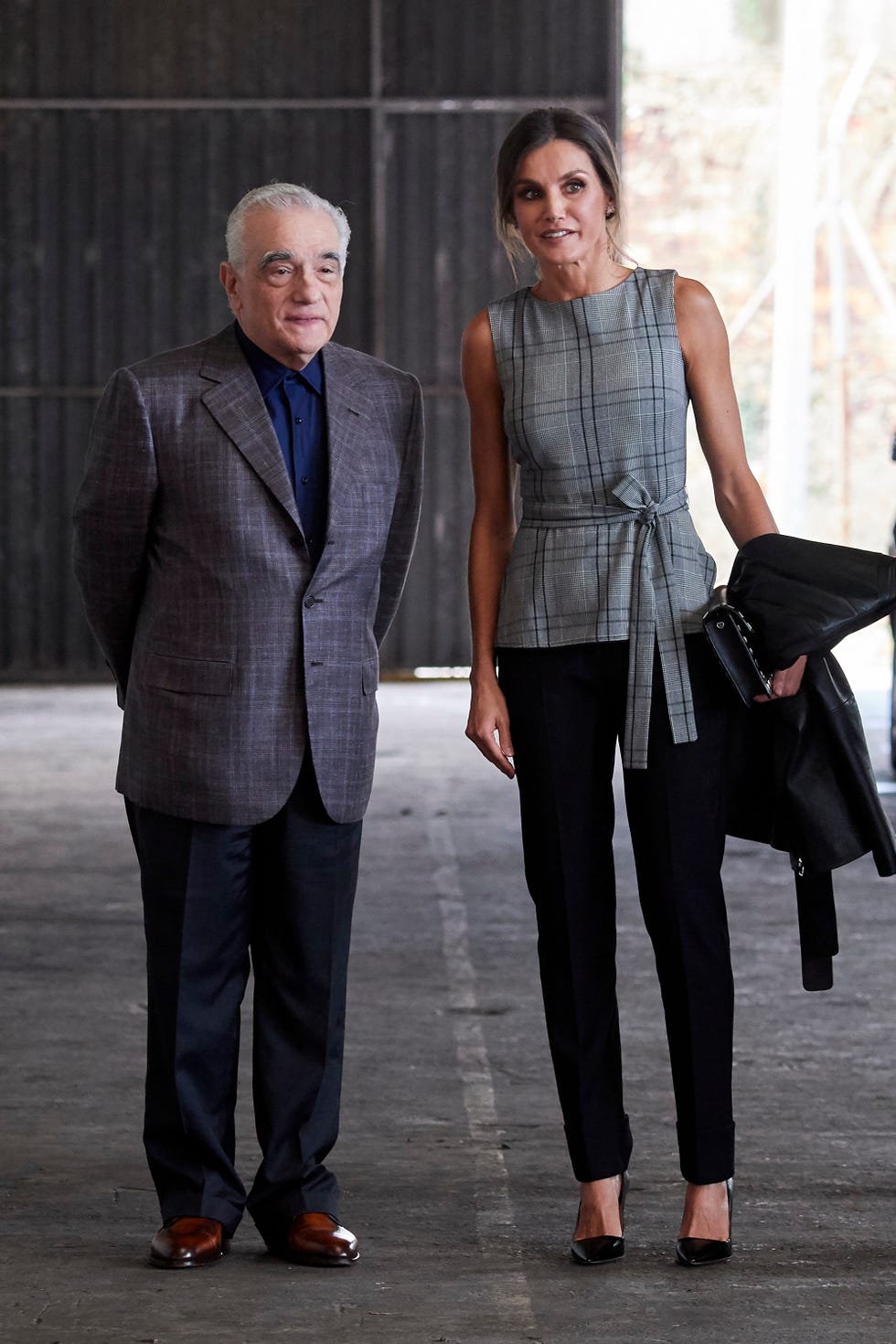 Clothing, Fashion, Suit, Standing, Human, Street fashion, Blazer, Formal wear, Jeans, Footwear, 