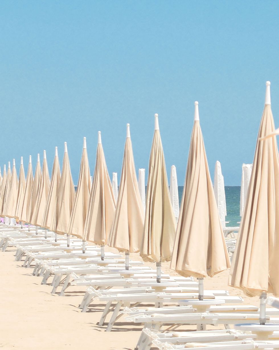 a row of umbrellas on a beach