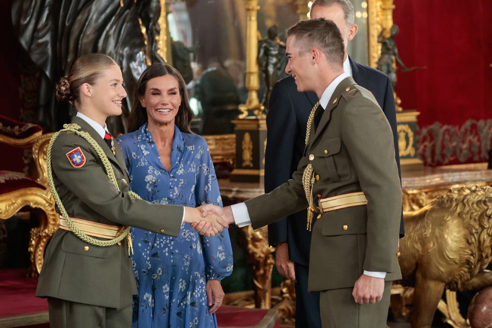a man shaking hands with a woman