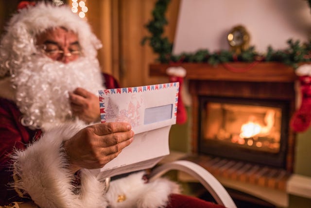 santa claus reading a letter