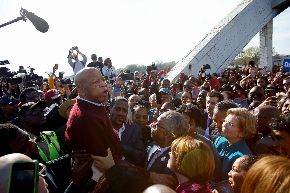 democratic presidential candidate, former south bend mayor pete buttigieg 3r top, reverend al sharpton, and democratic presidential candidate senator elizabeth warren d ma r listen to us representative john lewis d al speak as they march  march during the annual bloody sunday march across the edmund pettus bridge in selma, alabama on march 1, 2020 photo by joshua lott  afp  the erroneous mentions appearing in the metadata of this photo by joshua lott has been modified in afp systems in the following manner buttigieg instead of puttigieg please immediately remove the erroneous mentions from all your online services and delete it them from your servers if you have been authorized by afp to distribute it them to third parties, please ensure that the same actions are carried out by them failure to promptly comply with these instructions will entail liability on your part for any continued or post notification usage therefore we thank you very much for all your attention and prompt action we are sorry for the inconvenience this notification may cause and remain at your disposal for any further information you may require photo by joshua lottafp via getty images