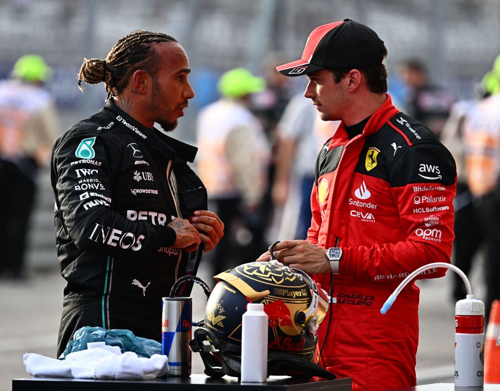 formula 1 drivers lewis hamilton and charles leclerc talking together after a grand prix