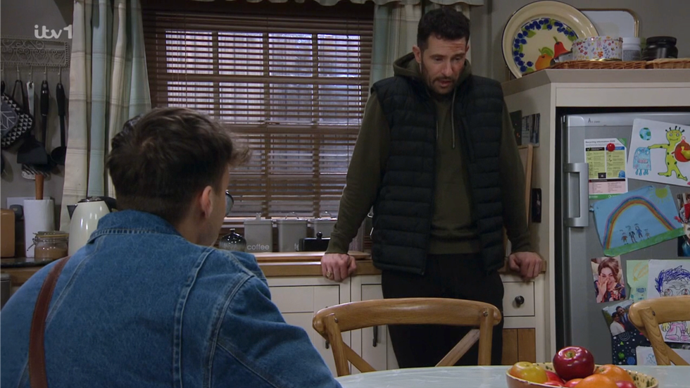 lewis and ross barton have a chat in the kitchen on emmerdale