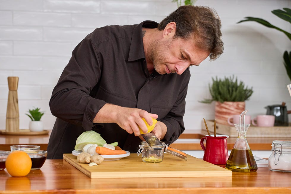 A man cuts vegetables