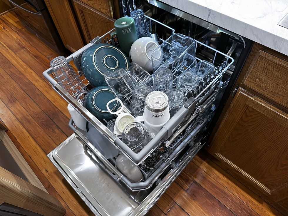 dishwasher loaded with cups and bowls
