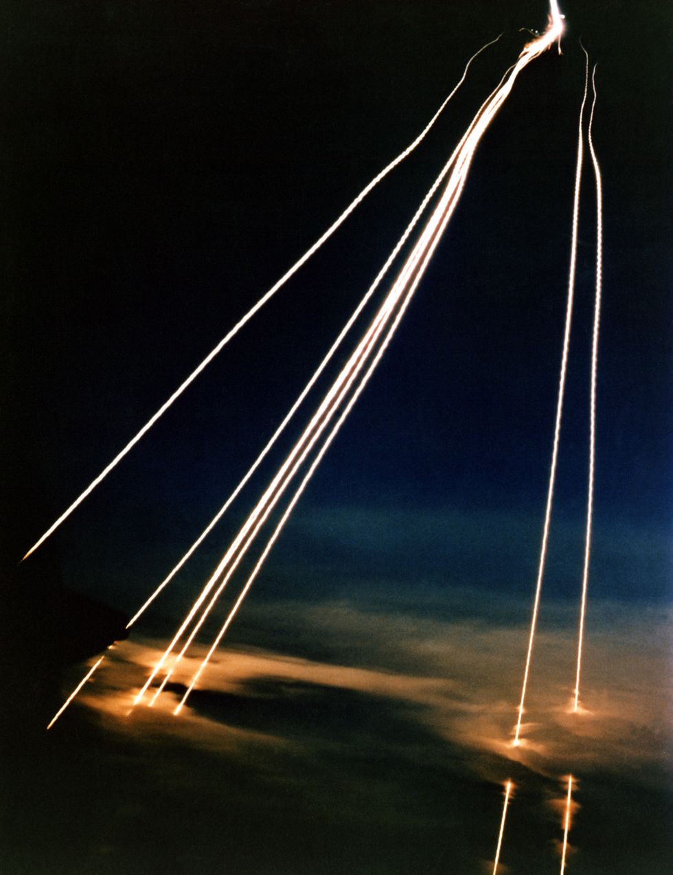 a time exposure of eight peacekeeper lgm 118a intercontinental ballistic missile reentry vehicles passing through clouds while approaching an open ocean impact zone during a flight test substandard