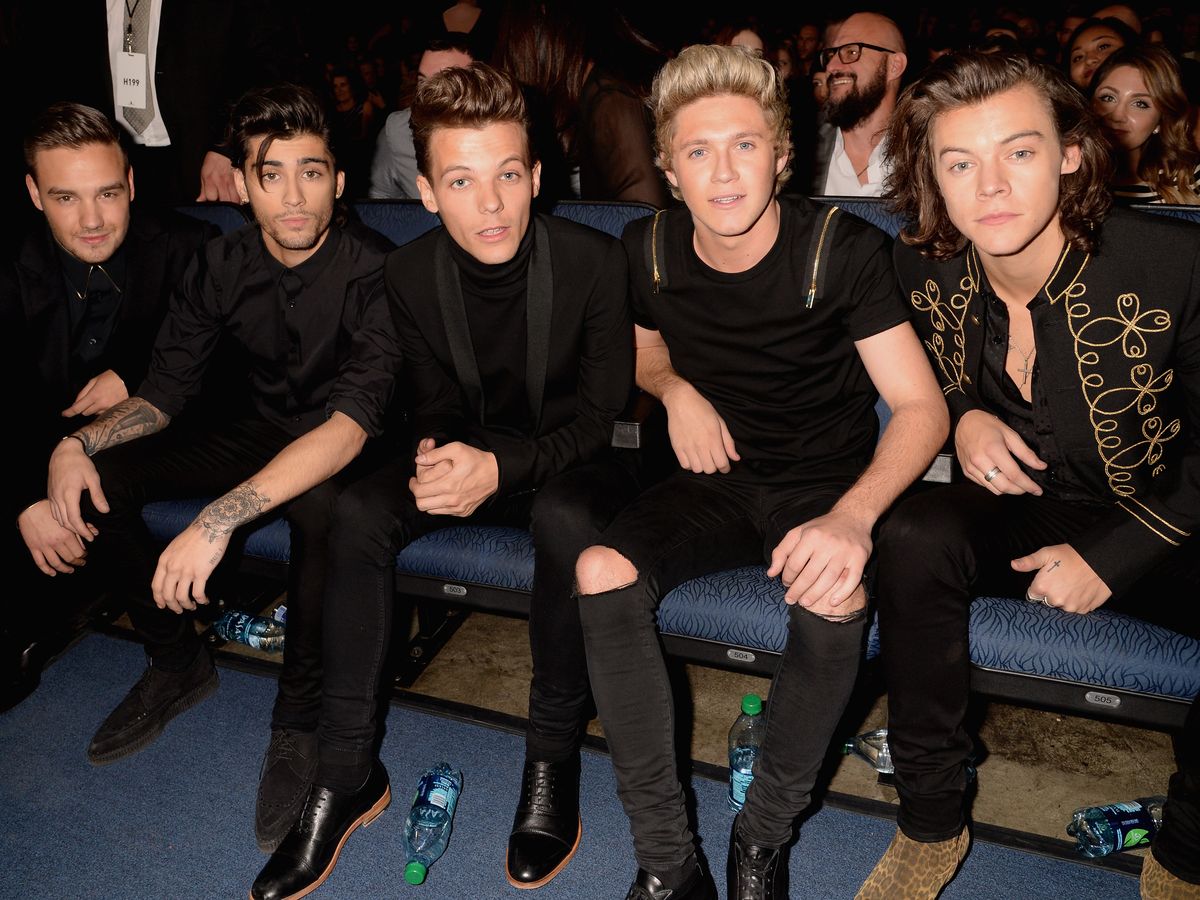 Louis Tomlinson says One Direction's first album was 's**t