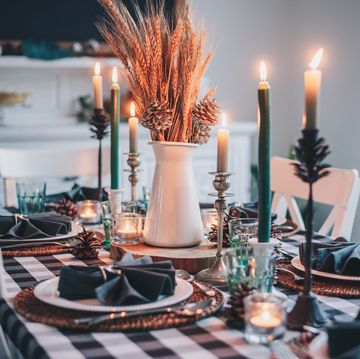 a table with candles and plates