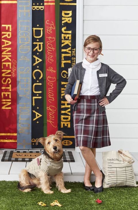 librarian assistant dog costume with ribbed sweater, monocle, and name tag