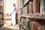 librarian with the book cart