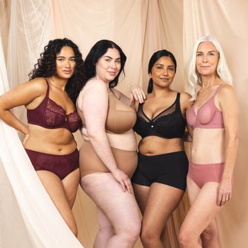 group of women modeling lingerie in a studio setting