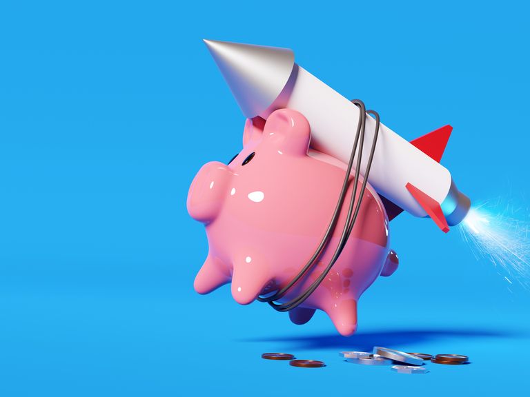 super charging your savings a pink piggy bank strapped to a rocket launching it into the air money and savings concept 3d illustration