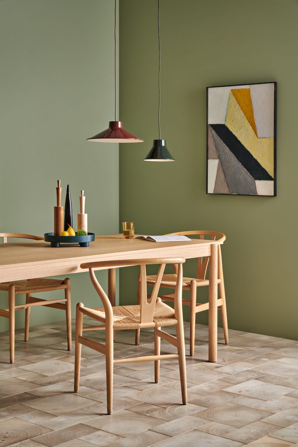 modern dining area featuring wooden furniture and artistic wall decor