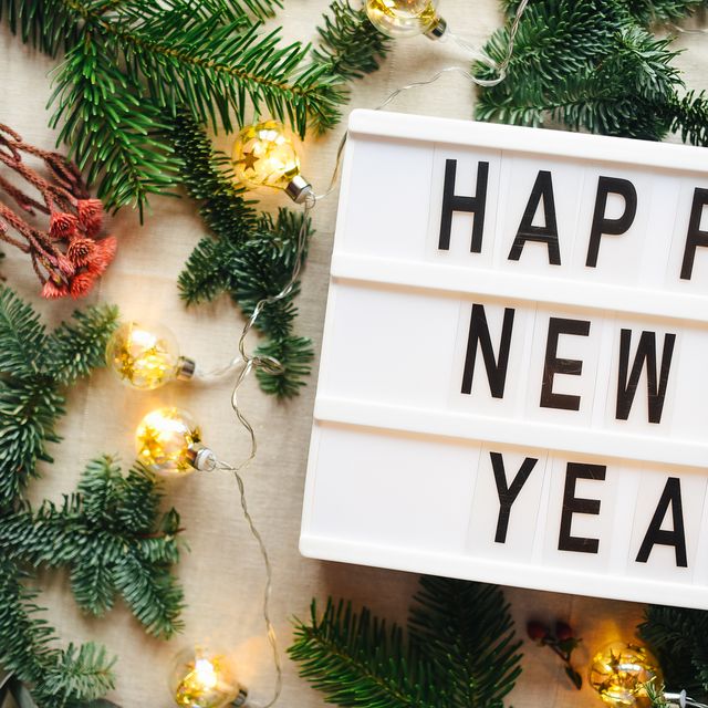 https://hips.hearstapps.com/hmg-prod/images/lightbox-with-inscription-happy-new-year-christmas-royalty-free-image-1701707260.jpg?crop=0.668xw:1.00xh;0.332xw,0&resize=640:*