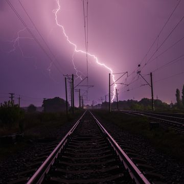 lightning over the railroad at night