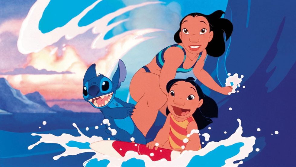 lilo and stitch, with the duo and nani surfing a wave on a board