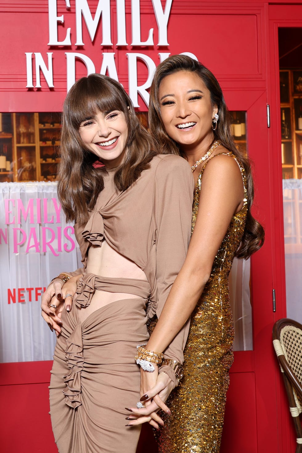 lily collins and ashley park smile next to each other at tv premiere